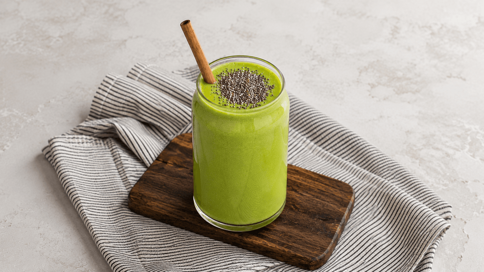 Creamy keto avocado lime coconut shake served in a chilled glass